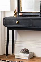 Console Ringo noire et dorée